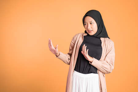 Young asian muslim woman refusing with both palms gestureの写真素材