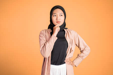 expression of a girl with hijab feeling uncertainの写真素材