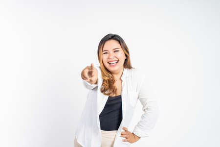 woman smiling while pointing her finger toward cameraの写真素材