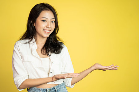 beautiful asian woman with hand gesture presenting