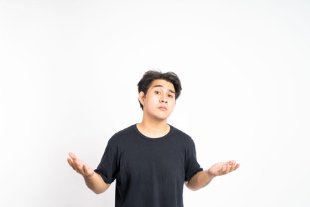 man with both hands open looking forward with a questioning expression