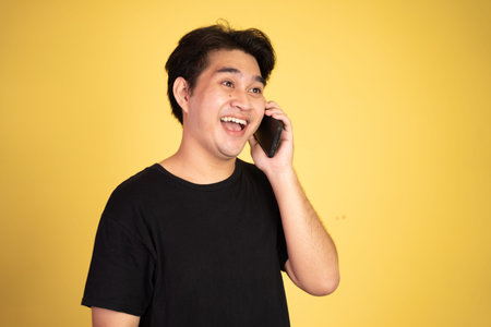 man laughing while making phone call on isolated background
