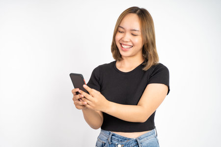Young asian woman using smart phone typing and online browsing on social media platform