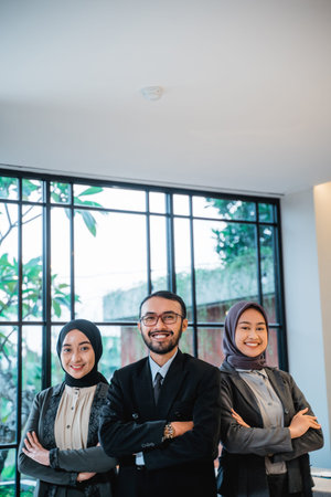 businessman leader as he standing in front of his team smiling proudly to cameraの写真素材