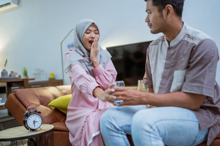 excited couple hearing adhan voices that mean iftar time or the for breaking the fast