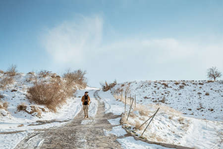 portrait of asian man hiking on beautiful natural landscape in cappadocia turkeyの写真素材