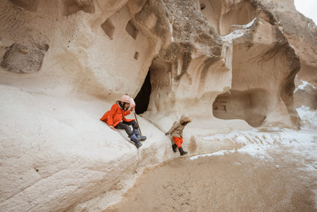 kid enjoy playing in the cave of pasabag valley cappadociaの写真素材