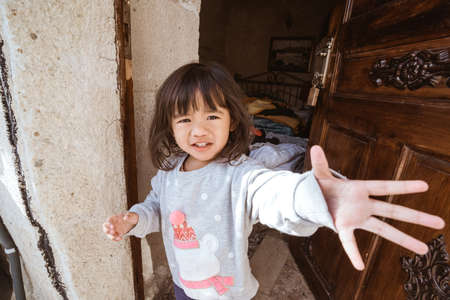 portrait of cute asian little girl looking at cameraの写真素材