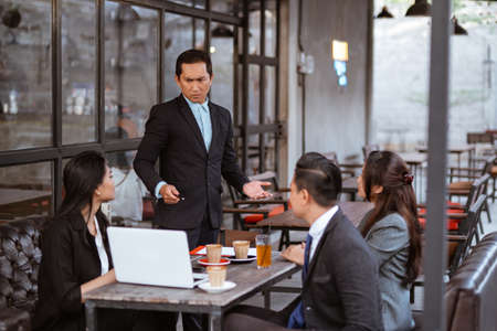 portrait of asian business people having an argument during meeting with partnerの写真素材