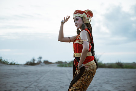 portrait young women presenting traditional Javanese dance movementsの写真素材