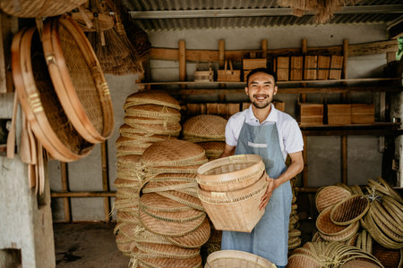 portrait of male handicraft artist working at his shopの写真素材