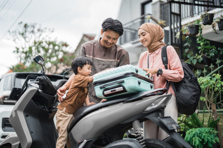 beautiful muslim family going with motorbike together during eid mubarak holidayの写真素材