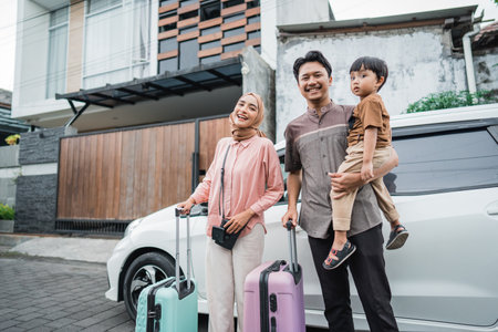 asian beautiful muslim family with suitcase travelling by car conceptの写真素材