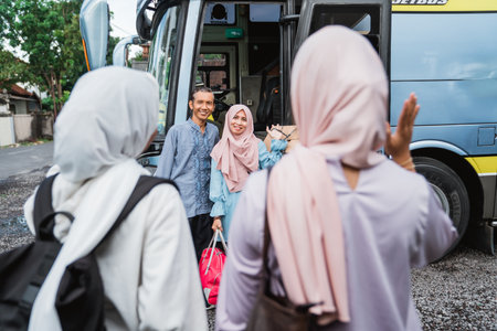 portrait of muslim family taking their parent to the bus station. eid ramadan travel conceptの写真素材