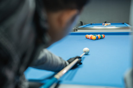 white ball poked by the male billiard player at the beginning of the game