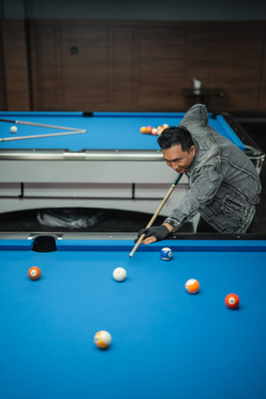 talented pool player poking the white ball on the billiard game