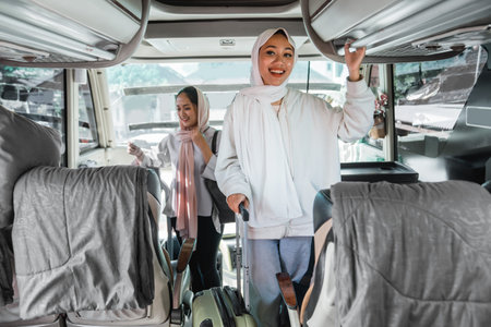 woman in a headscarf puts her bag on a bus shelf bagage while traveling during eid mubarak holiday