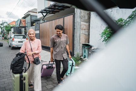 asian muslim couple with suitcase prepare to go. concept of man and woman travelling for eid mubarak...