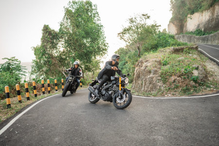asian bikers going on adventure by riding motorbike