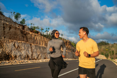 happy sporty couple enjoying running together in outdoor, jogging concept