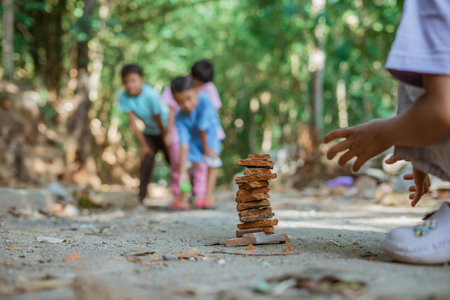 selective focus of kid hand playing traditional stacking gameの写真素材