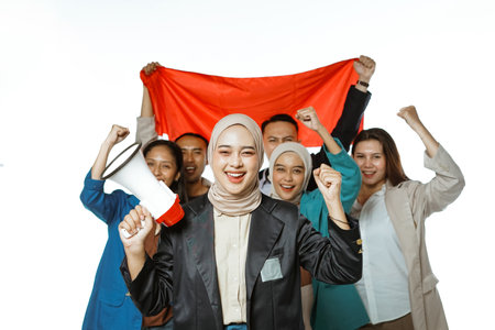 happy student holding megaphone with raised in isolated backgroundの写真素材