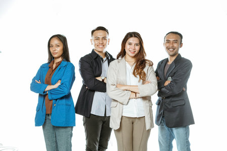 asian student standing in isolated background with crossed armの写真素材