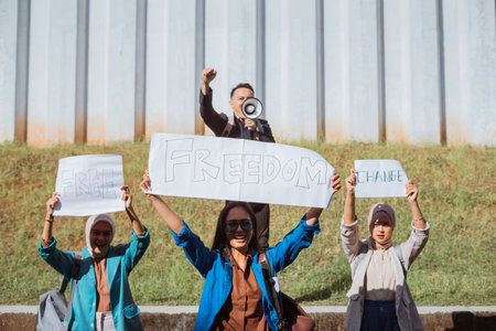 Protesters raise their voices for social change and justice in a powerful rally.の写真素材