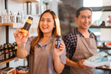 blurred picture of staff holding paint product for shoesの写真素材