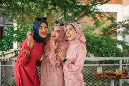 Three joyful friends relishing a delightful, sunny day together, enjoying the outdoors