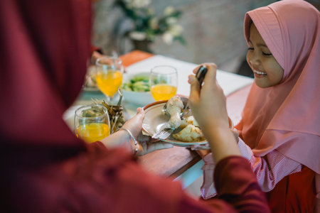 A heartwarming moment shared with family over a spread of delicious and delightful foodの写真素材