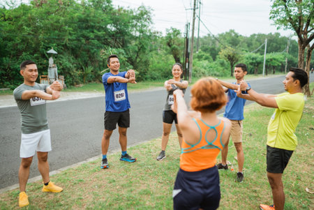 athlete warming up before running on marathon trackの写真素材