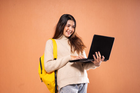 A happy student with a laptop, representing a modern learning lifestyle and education approach