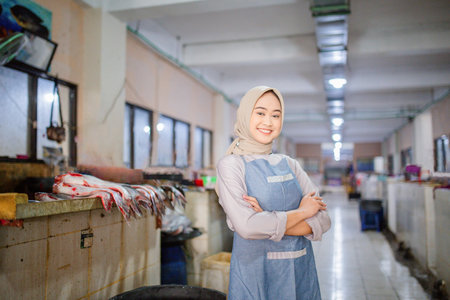 A very friendly vendor stands confidently and proudly in a vibrant and colorful market