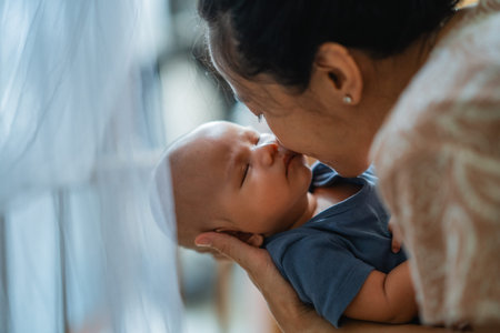 A heartwarming bond between a loving mother and her newborn baby, in gentle light