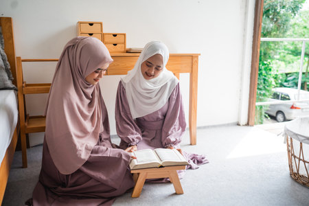 A group of women engaging in their studies together in a calm and peaceful indoor environmentの写真素材