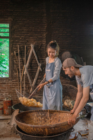 In a rustic workshop, two skilled artisans are expertly crafting beautiful handmade goods