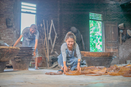 Dedicated artisans who are engaged in the traditional methods of textile production techniquesの写真素材