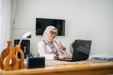 A qualified professional woman wearing a sleek white coat engaged in a virtual online consultationの写真素材