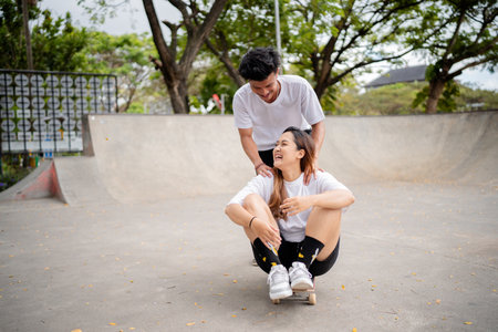 Friends laughing at the skate park, capturing the spirit of youth and friendshipsの写真素材