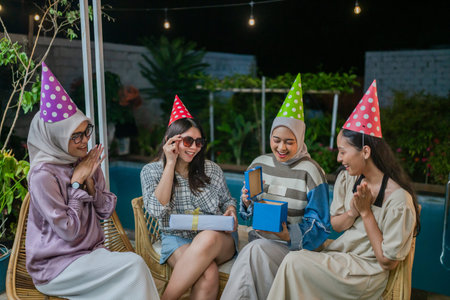 A group of friends at a festive gathering full of party hats and joyful laughter