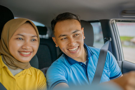 Happy friends capturing beautiful memories together while having fun during their driveの写真素材