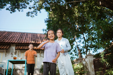 asian young girl celebrate victory with fist hand gestureの写真素材
