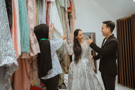 A fitting session showcasing stunning dresses and vibrant designs that captivateの写真素材