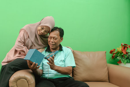 A heartwarming moment shared by a loving couple celebrating a special occasion togetherの写真素材