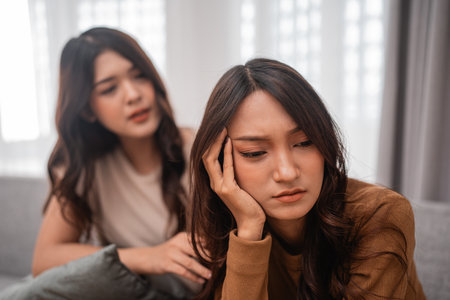 A close friend provides warmth and support during a challenging moment, showcasing true friendshipの写真素材