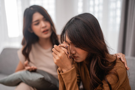 Two close friends share a heartfelt moment, offering each other vital support during tough timesの写真素材