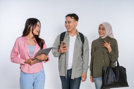 Friends are enjoying a delightful connection through gadgets, filled with laughter and conversationの写真素材