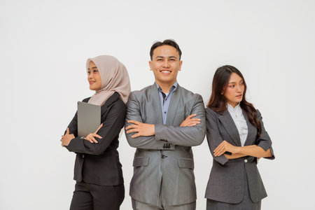 Stylish business professionals pose confidently to showcase individuality in a corporate shootの写真素材