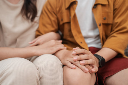 A tender and intimate moment shared between a loving couple enjoying a gentle touchの写真素材